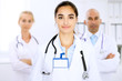 © rogerphoto - Happy doctor woman  with medical staff at the hospital