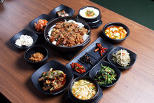 A Traditional Korean Tray Meal On Wooden Table