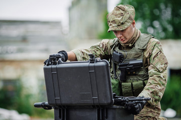 Soldiers on patrol in destroyed city. Military and rescue operat