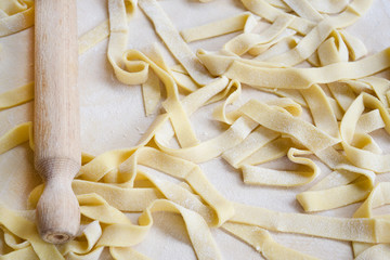 chef at home making fresh tagliatelle