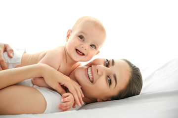 mother and baby on bed