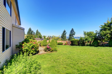 Well kept garden at the backyard with trees and bushes