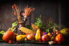 Various Fall Fruits And Vegetables On Dark Rustic Kitchen Table At Wooden Background, Side View,copy Space. Autumn Harvest Concept.