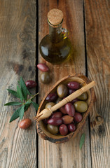 Wall Mural - Olives in a bowl with spices oregano