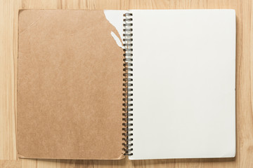 Open notebook on wood background. Empty page background for desi