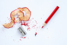 Red Wooden Pencil, Pencil Shavings And Sharpener On White