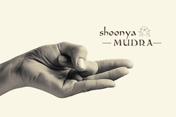 B/W image of woman hand in Shoonya mudra. Gesture is  isolated on toned background.