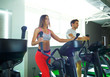 © vladstar - Athletic man and woman doing cardio training program in fitness