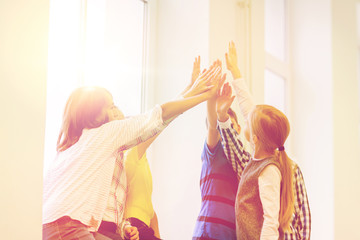 Poster - group of school kids making high five gesture