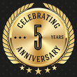 Gold celebrating 5 years badge, button on black background