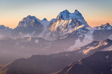 Wall Mural - ushba mountain and clear sky on sunset