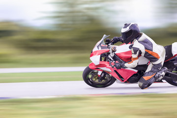 Wall Mural - Motorcycle leaning into a fast corner on highway