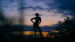 © kustvideo - carefree woman dancing in the sunset. vacation vitality healthy living concept.