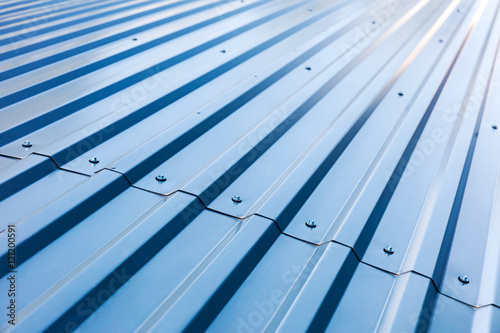 Obraz Dibond blue corrugated metal roof with rivets, industrial background