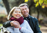 Fototapeta Miasto - Portrait of happy smiling  elderly couple