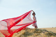 © vladimirvu - girl in field with cloth