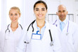 © rogerphoto - Happy doctor woman  with medical staff at the hospital
