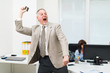 © Minerva Studio - Angry businessman throwing away his phone