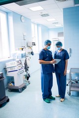 Poster - Surgeons discussing over digital tablet