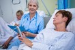 © WavebreakMediaMicro - Patient using medical device and nurse sitting