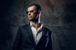 © Fxquadro - Portrait of male in sunglasses and grey business jacket.