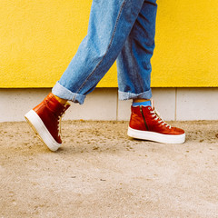 Wall Mural - Step in Fall. Stylish red sneakers. Urban fashion