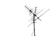 TV And Communication Aerials On Roof Of Residential House, Isolated Antennas And Dish