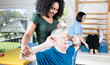 Elder people making exercises in a rehab clinic for ritired