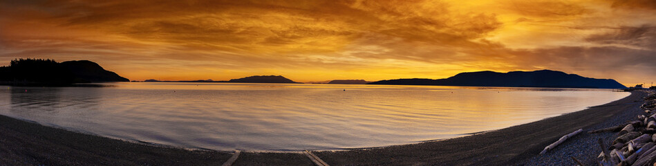 Wall Mural - San Juan Islands Sunset. A beautiful winter sunset from Legoe Bay on Lummi Island looking west towards Orcas Island in the San Juan archipelago in western Washington state.