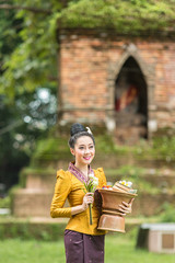 Wall Mural - Laos woman beautiful dressed in traditional dress nicely in temp