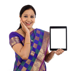 Wall Mural - Traditional Indian woman using a tablet computer