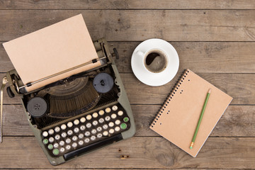 Fototapete - Vintage typewriter on the old wooden desk
