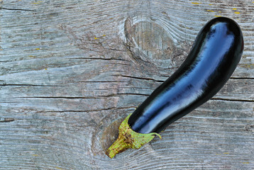 Black eggplant on a old wooden table