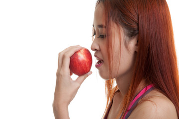 Wall Mural - Beautiful Asian healthy girl with red apple.