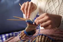 Woman Knitting Small Socks