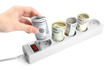 Sticker - Woman hand putting dollars into power socket on white background