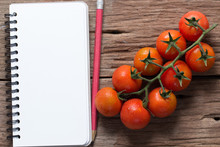 Cherry Tomatoes With Notepaper On Wood