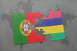 puzzle with the national flag of portugal and mauritius on a world map background.