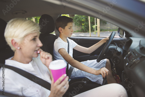 small boy driving car