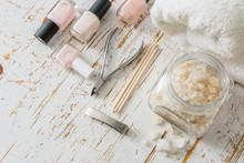 Selection Of Manicure Tools On White Wood Background