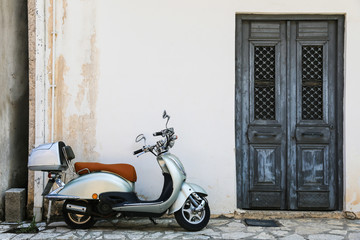 Vespa parked on old street 