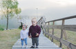 © Irina84 - Children are on the river jetty. Little brother and the sister walk upstairs.