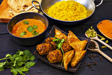 Indian Pilau Rice In Balti Dish Served With Chicken Tikka Masala