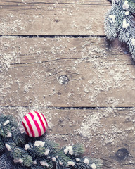  Christmas balls  and branches fur tree on aged wooden backgroun