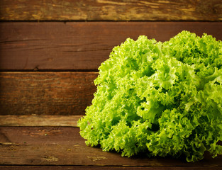 Large bunch of fresh Organic vegetables, salad on old wooden table