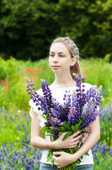 Poster - girl with bouquet of lupine flowers