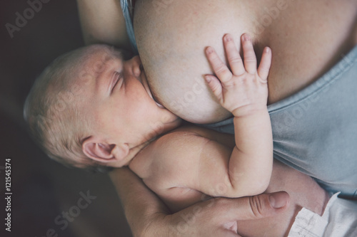 Cuadros en Lienzo Mother breastfeeding her newborn baby boy. Mom nursing small kid.