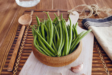 Green Beans In A Bowl On A Wooden Table