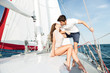 © Drobot Dean - Young beautiful married couple kissing on the yacht