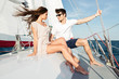 © Drobot Dean - Young beautiful married couple embracing on the yacht
